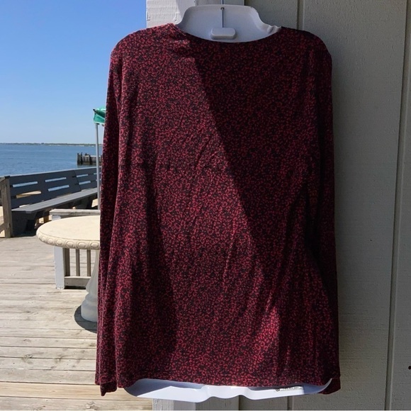 It’s red and black top has a Lovely lace V-neck with a little red bow. So soft! - Picture 3 of 5